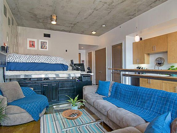 Spacious living area, with wall mounted flat-screen TV