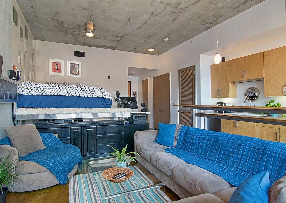 Spacious living area, with wall mounted flat-screen TV