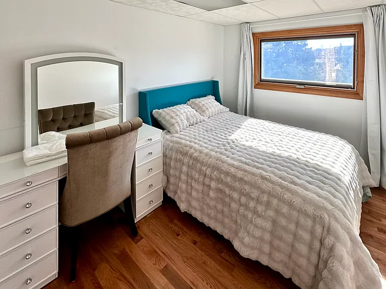 Bedroom 2 with vanity/desk and 6 feet of closet space. Sunny southern mountain view and black-out curtains.