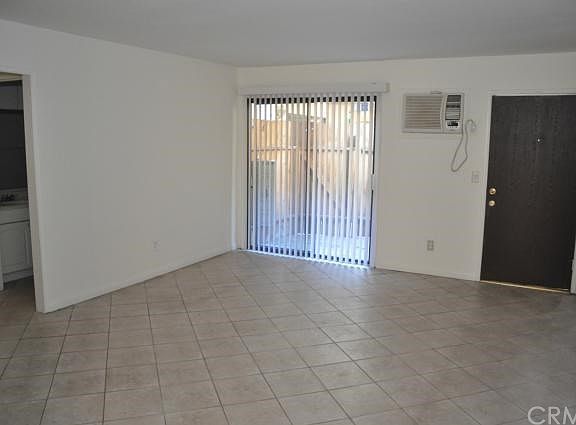 Spacious living room with window A/C.