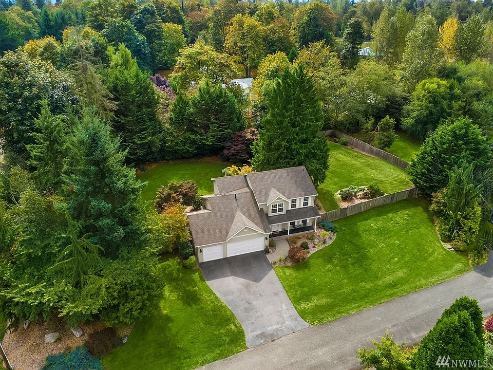 Welcome home to this private sanctuary on approximately 2/3's of an acre in Redmond!