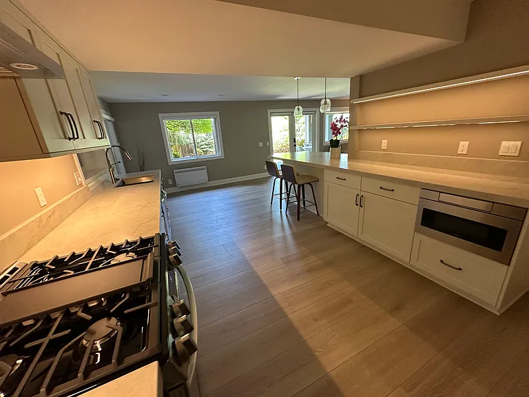 New kitchen with high end appliances, washer dryer in closet