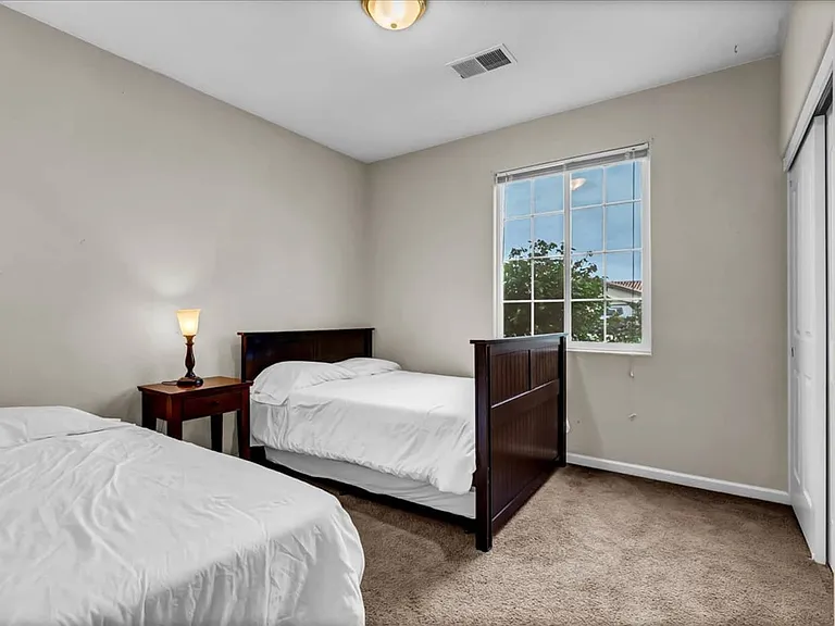 bedroom 1 with 2 queen beds