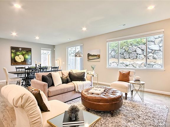 Living room is open to dining area in kitchen.