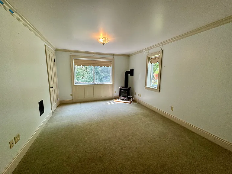 Family room with working gas stove; door to the laundry room to the left
