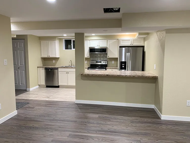 Dining Area Outside of Kitchen. Enough room to fit a large table. The over hang from the kitchen will allow for 3-4 bar stools for additional seating.