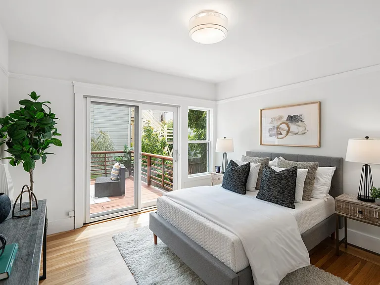 Upstairs bedroom with private access to outdoor deck