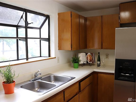 Light & Bright Kitchen with a lot of Cabinet Space. Refrigerator stays.  