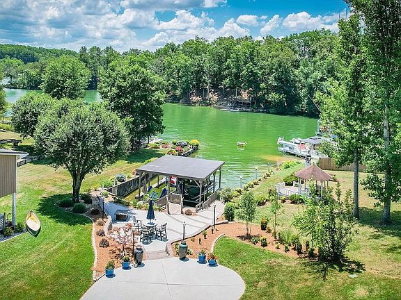 Lake Living with beautiful concrete patio and dock