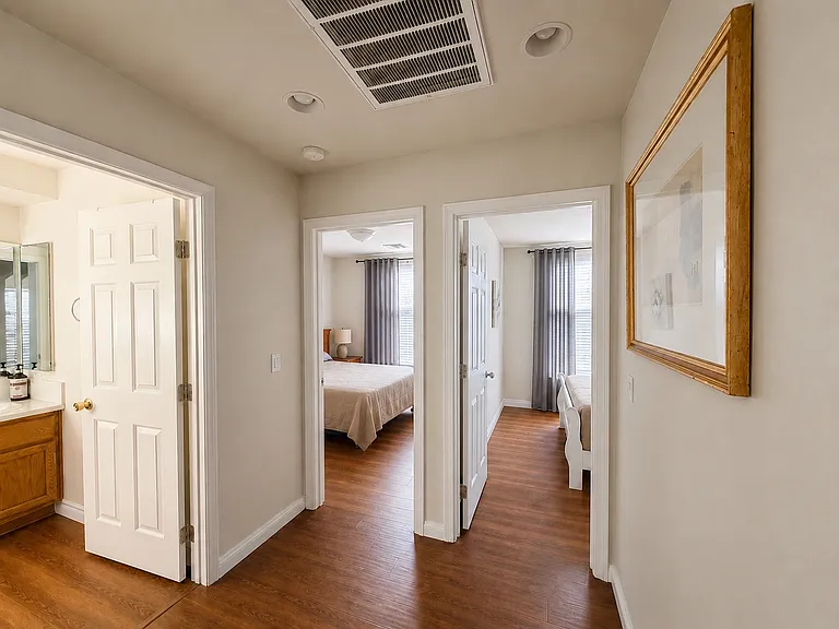 Second-floor hallway leading to the bedrooms and shared bathroom