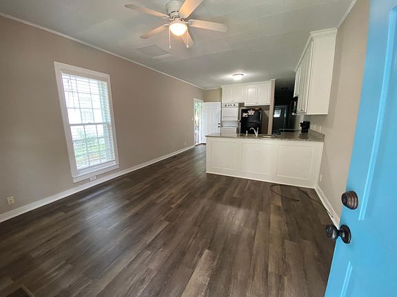Spacious, open floor plan. Luxury vinyl plank flooring. Large living area opens to large kitchen. Open layout perfect for entertaining.
