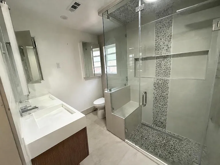 Master Bedroom Ensuite with illuminated make-up mirror, solar tube and towel warmer.