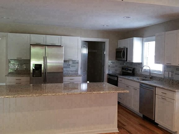 open kitchen , large one sink lots of cabinets