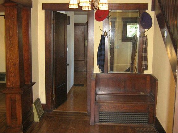 Foyer with original built in sitting bench!