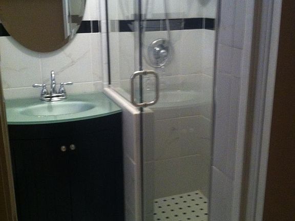 Glass shower with tile floor