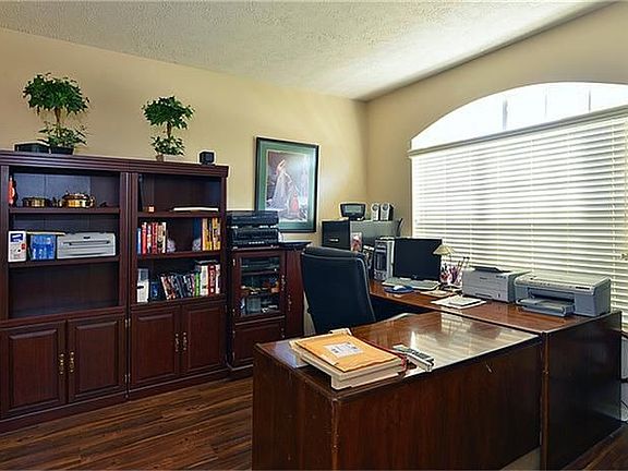 Open study with hardwood floors.