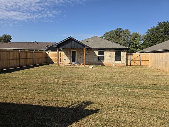 Back Yard - Lots of room to play. Features a Rain Bird Sprinkler System.