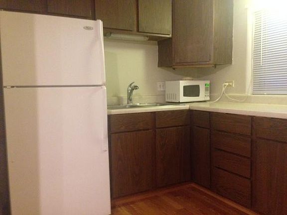 Kitchen refrigerator/countertop microwave/sink/cabinetry