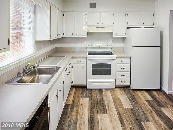 Newly painted Kitchen with newer Hardwood Floors.