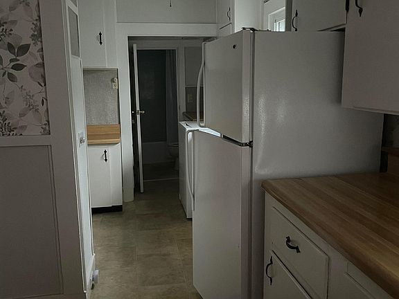 View from Dining room to kitchen with the bath at the end