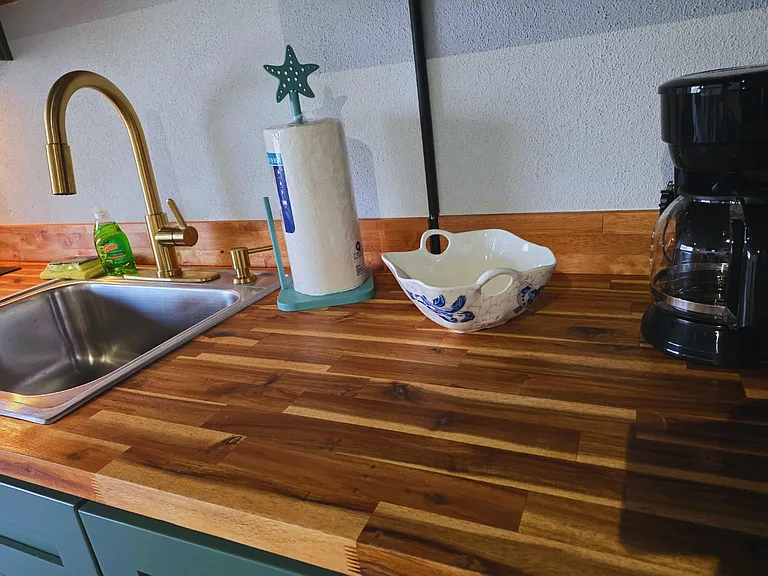 Clean-up is easy with a gold-accent sink, soap and paper drying towels.