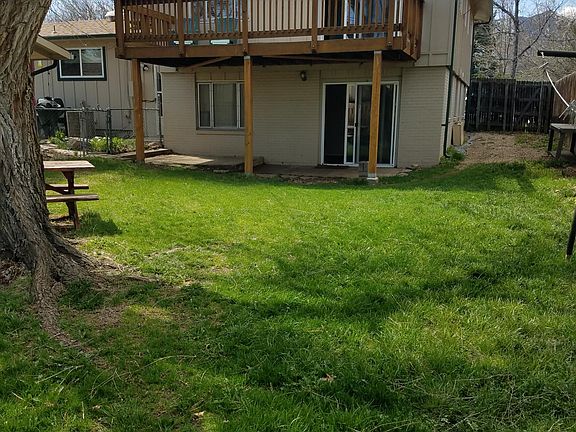 Private, fenced back yard for this apartment.