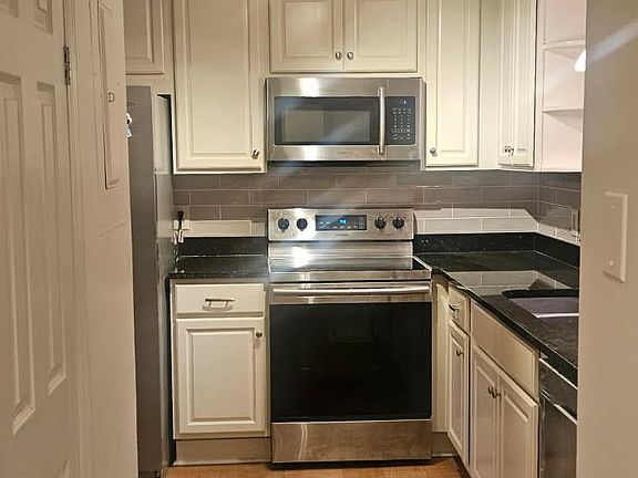 Kitchen with stainless appliances and granite counter tops