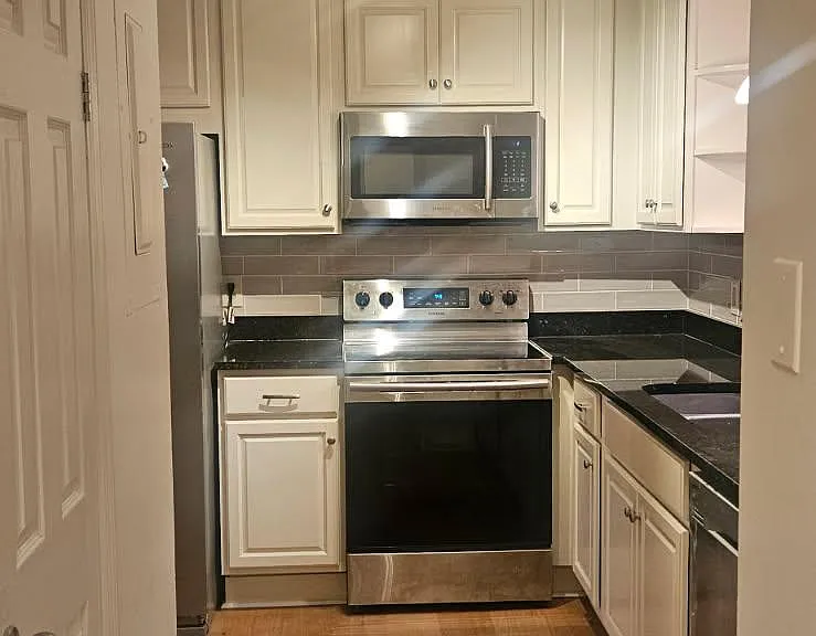 Kitchen with stainless appliances and granite counter tops