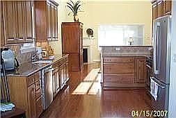Kitchen, hardwood flrs., 42" glazed cabinets, spice drawer, envir. disposal 
