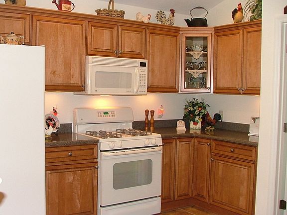 Maple cabinets, bisque appliances, tile floors, Corian countertops, WOW!