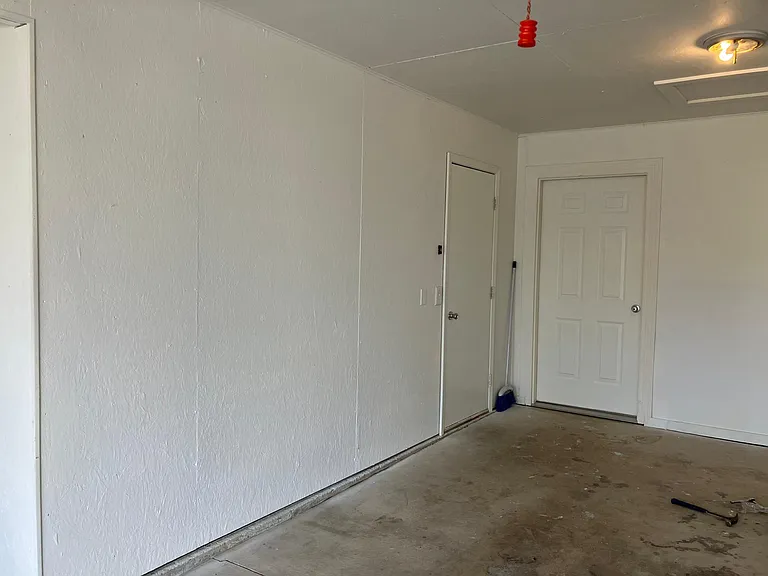 garage doors to unit and porch