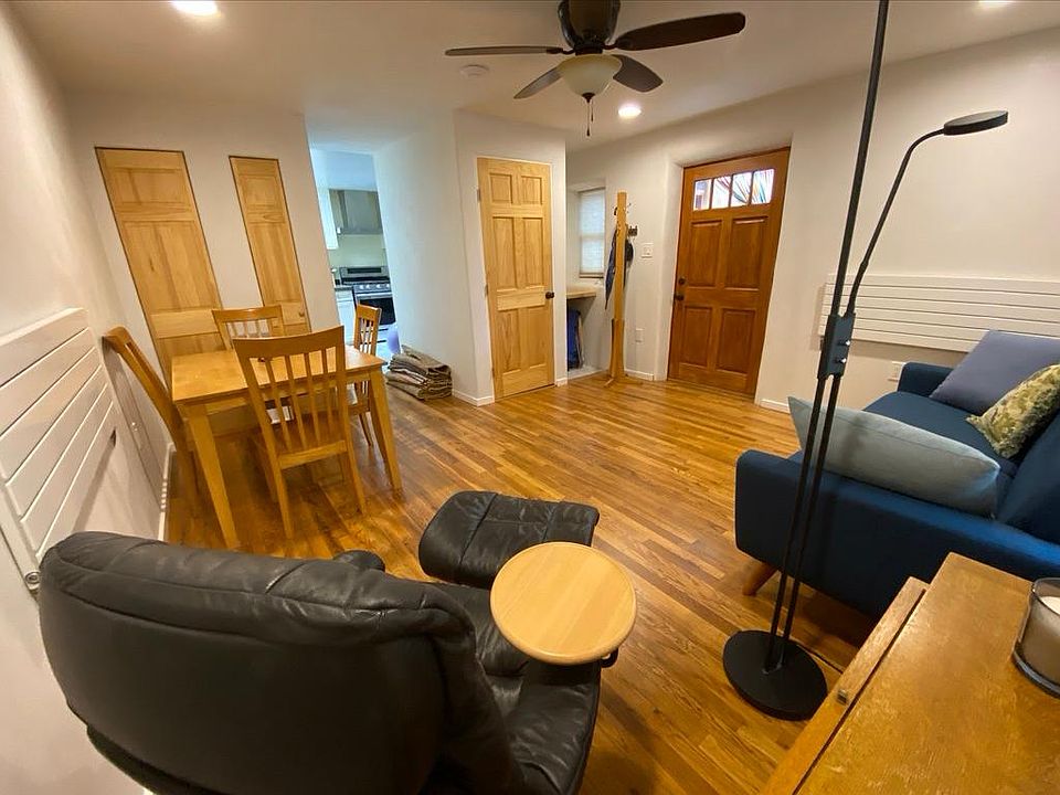 Living room view; kitchen entry in center
