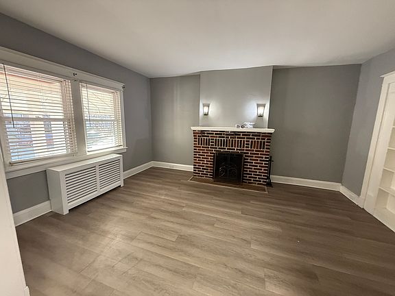 living room with lots of natural right, all new flooring throughout
