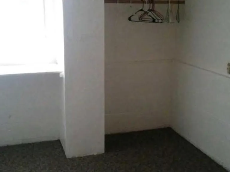 Lower floor bedroom to the west. There are two bedrooms downstairs and two bedrooms upstairs