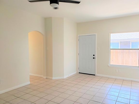 Living Room - View of Front Door and Hallway Entrance to Bedrooms & Bathrooms