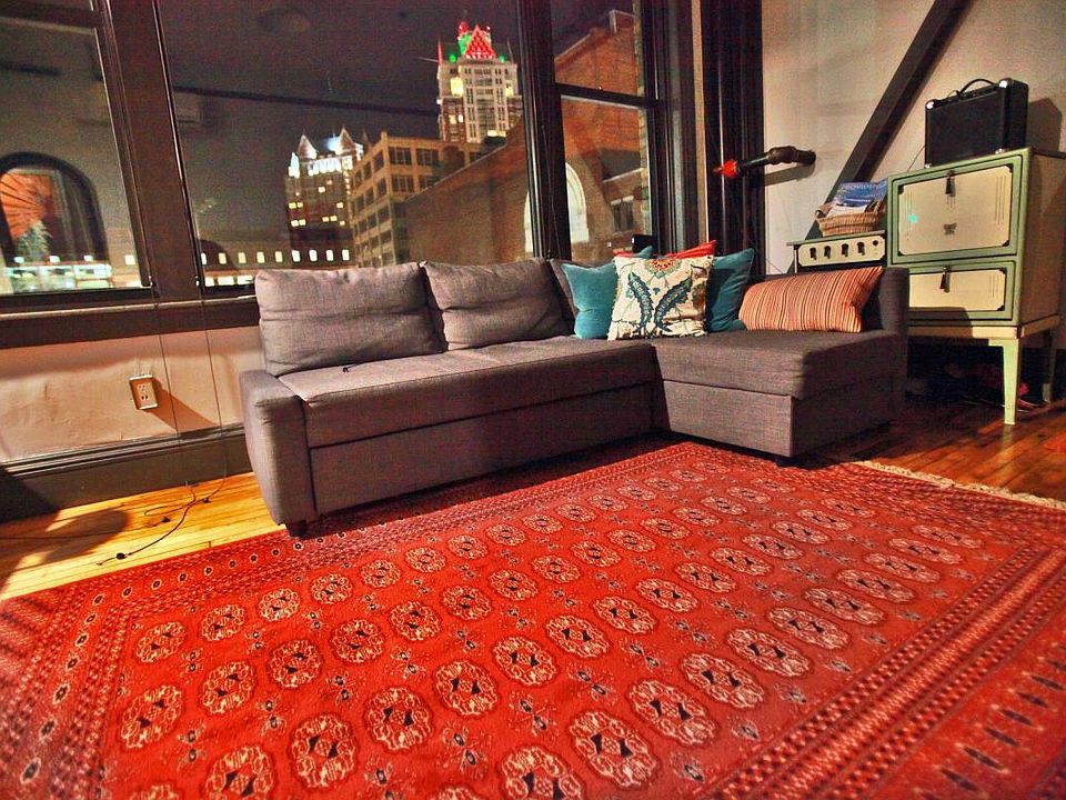 pull out sofa in living room and view of the city