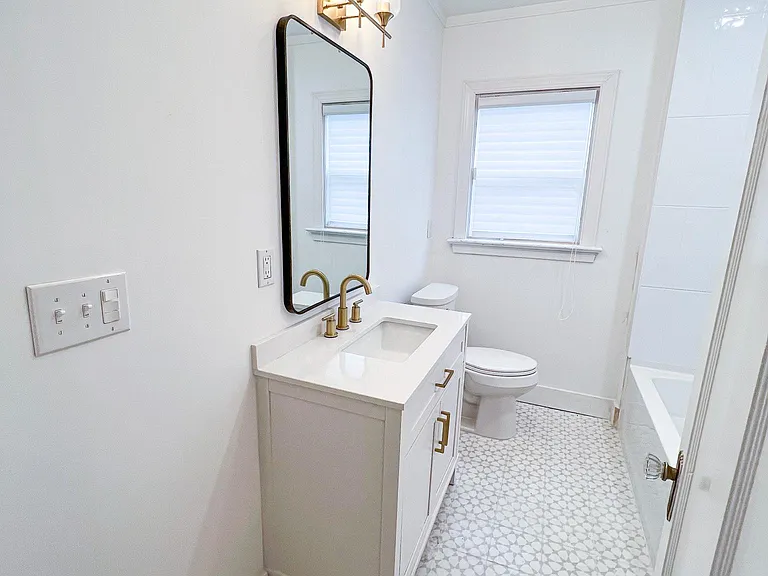 Main Bathroom. All new shower, vanity, etc. It sits between the middle and front bedrooms