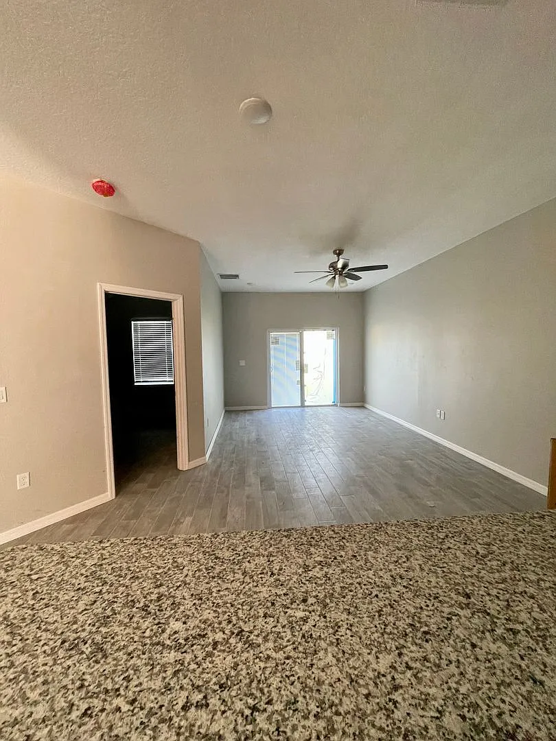 Nearly New Luxury 3-Bedroom Home with Designer Upgrades in Poinciana! — Photo 2