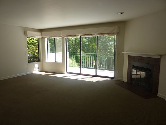 Living room with fireplace and large deck