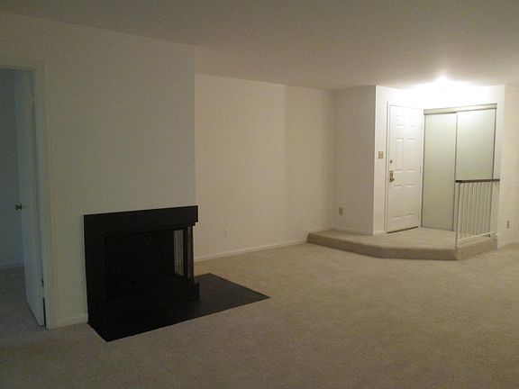 Entry with closet, Living Room, and Fire place