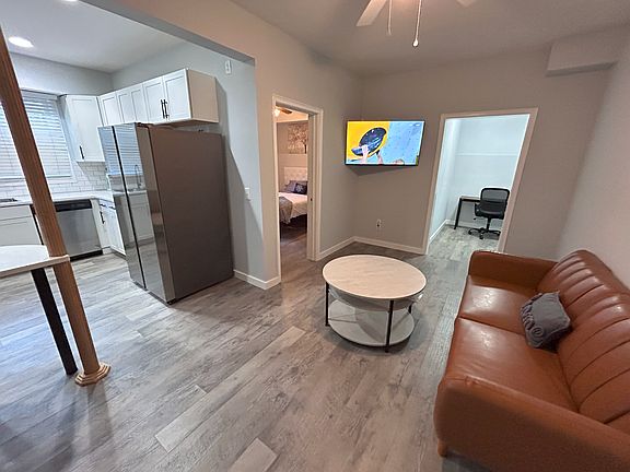 Living room with 50" TV and a dedicated work space