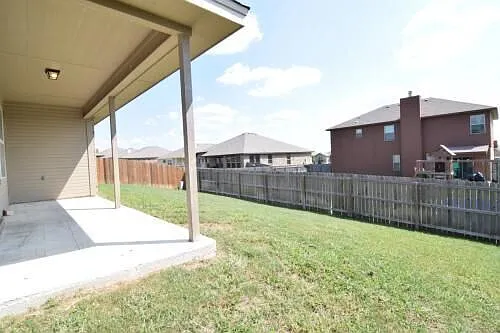 Back yard inviting, comfortable and fence safe. Perfect blend of openness and privacy.