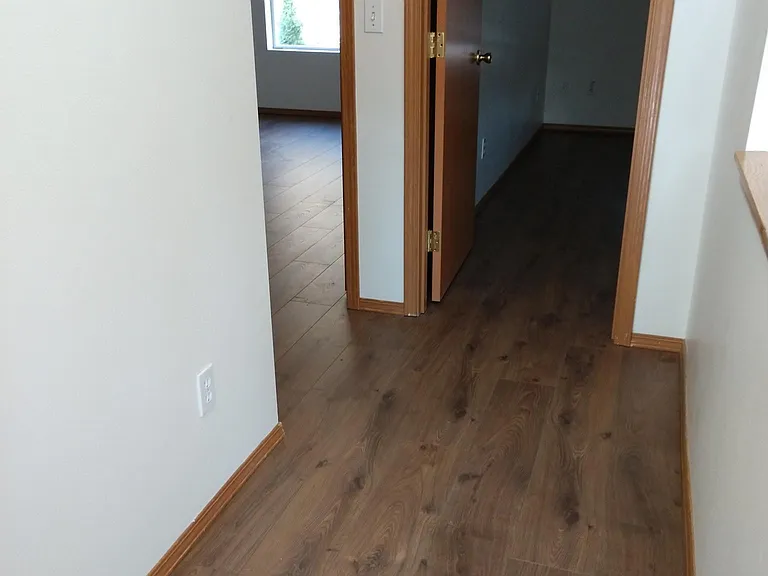 The three bedrooms and hallway upstairs feature attractive, hard surface floors.