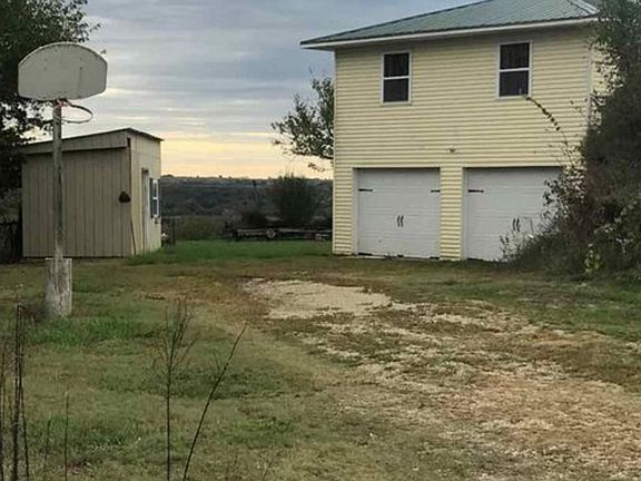 Drive Up to Garage and Shed