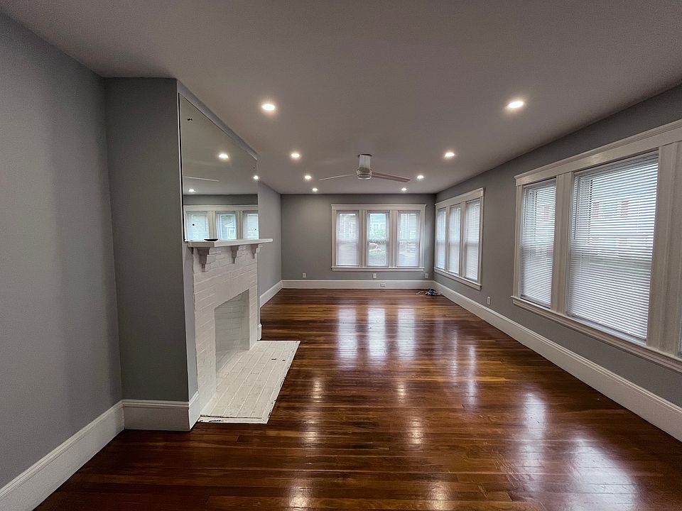 Large living room with new recessed lights and ceiling fan