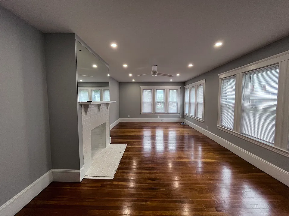 Large living room with new recessed lights and ceiling fan