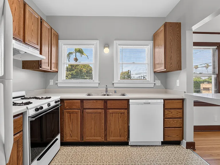 Kitchen with stove, refrigerator, and dishwasher