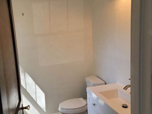 Downstairs half-bath, new vanity, new toilet, tiled floor
