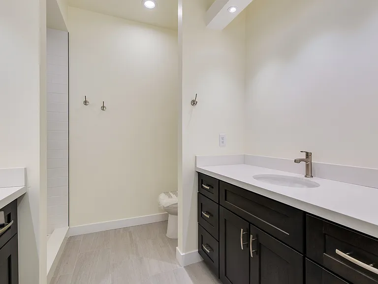 Upstairs bathroom with dual vanities (mirrors to be mounted)