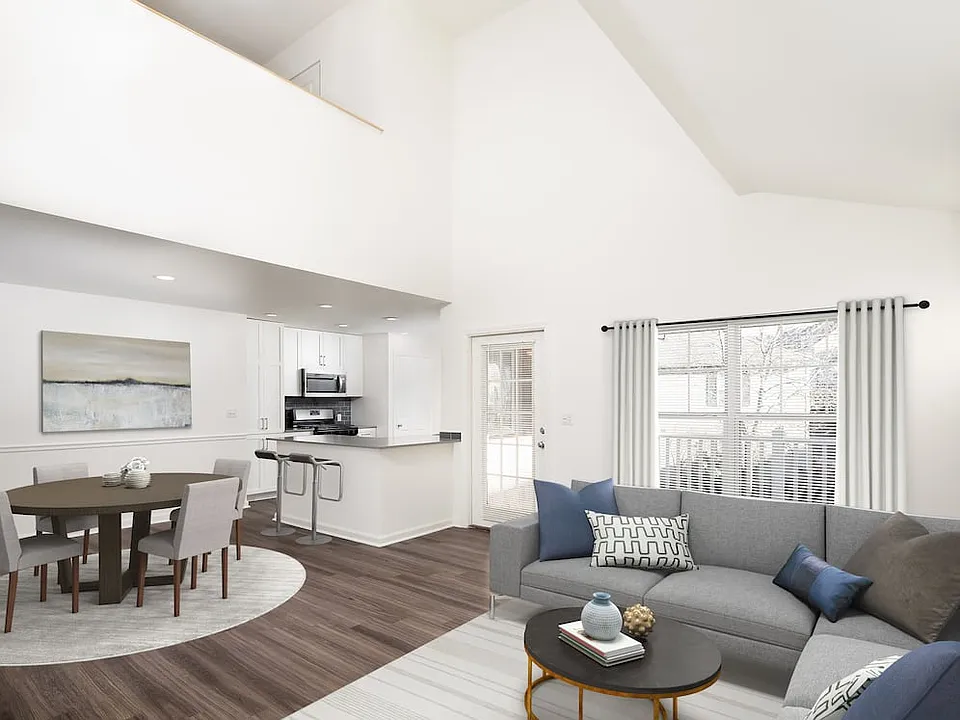 Kitchen, living, and dining areas with hard-surface flooring